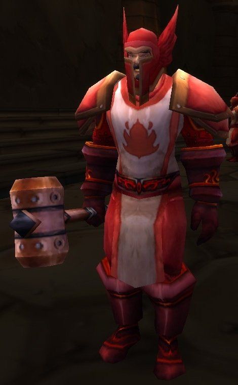 A living Scarlet Champion, whose gear the Fallen Champion still wears