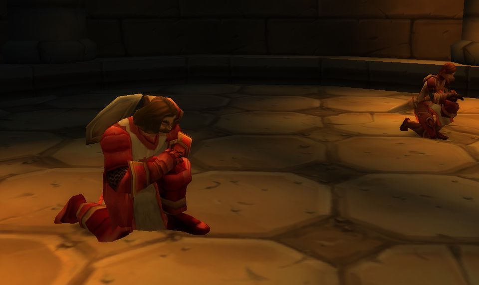 Crusaders kneel during the Corrupted Ashbringer event in the Cathedral